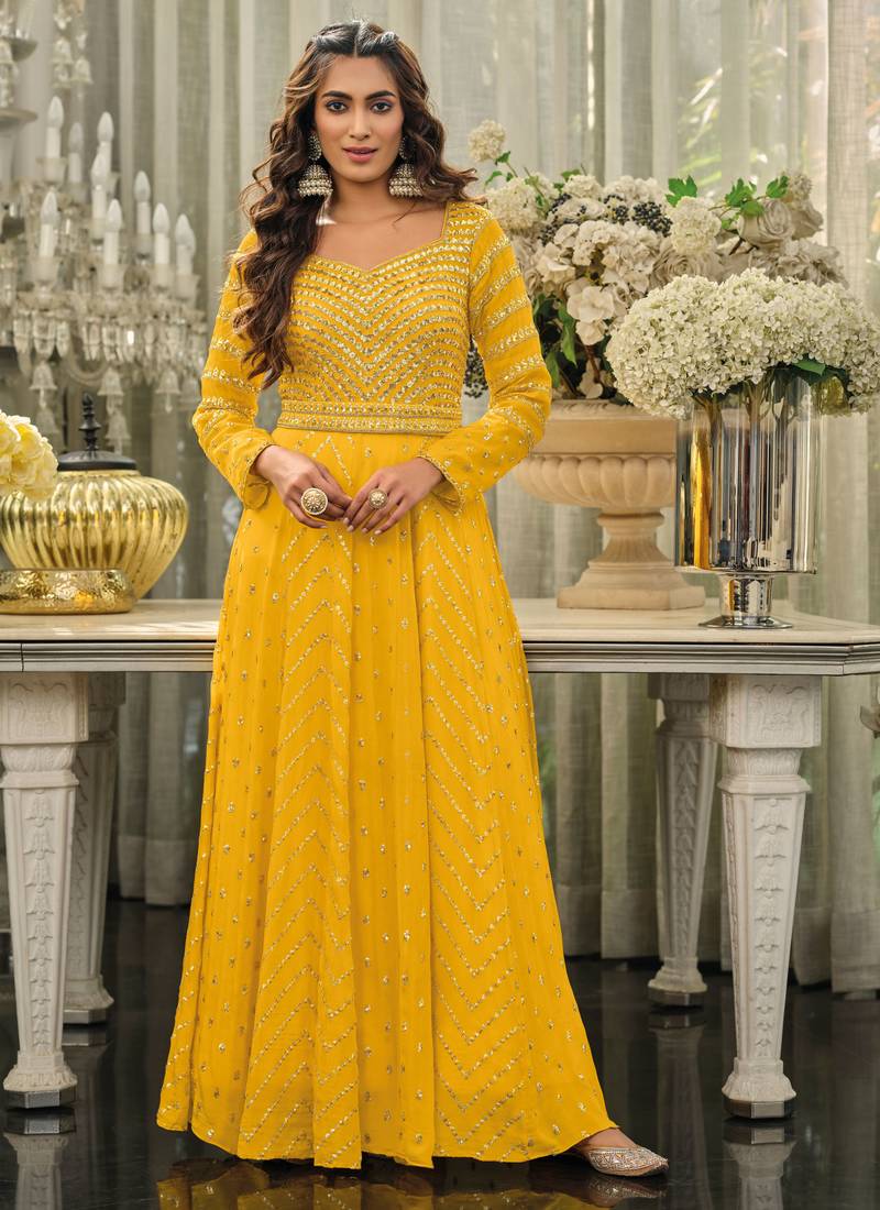 Yellow Anarkali Suit With Jhumkas And Bangles