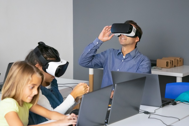 The Appeal of Virtual Saree Try-On Middle-aged teacher testing VR headset