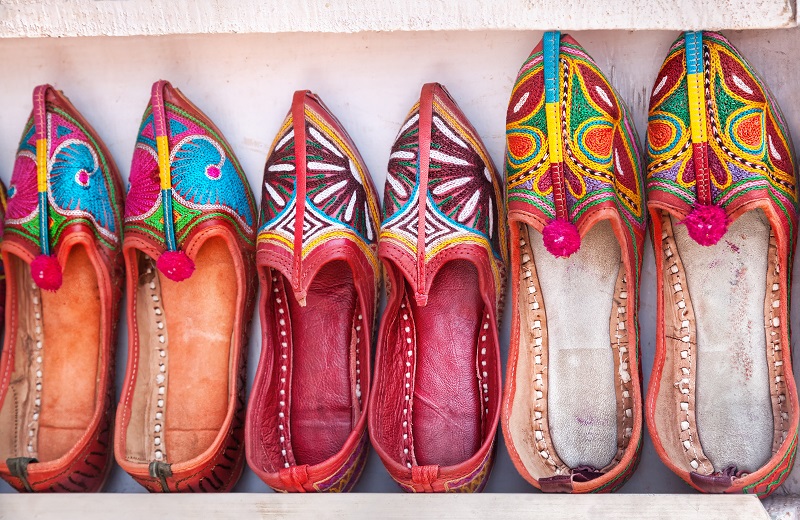 Classic Juttis: The Timeless Choice Colorful ethnic shoes at Anjuna flea market in Goa, India