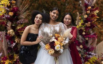 A Bride with flowers in hand with her friends
